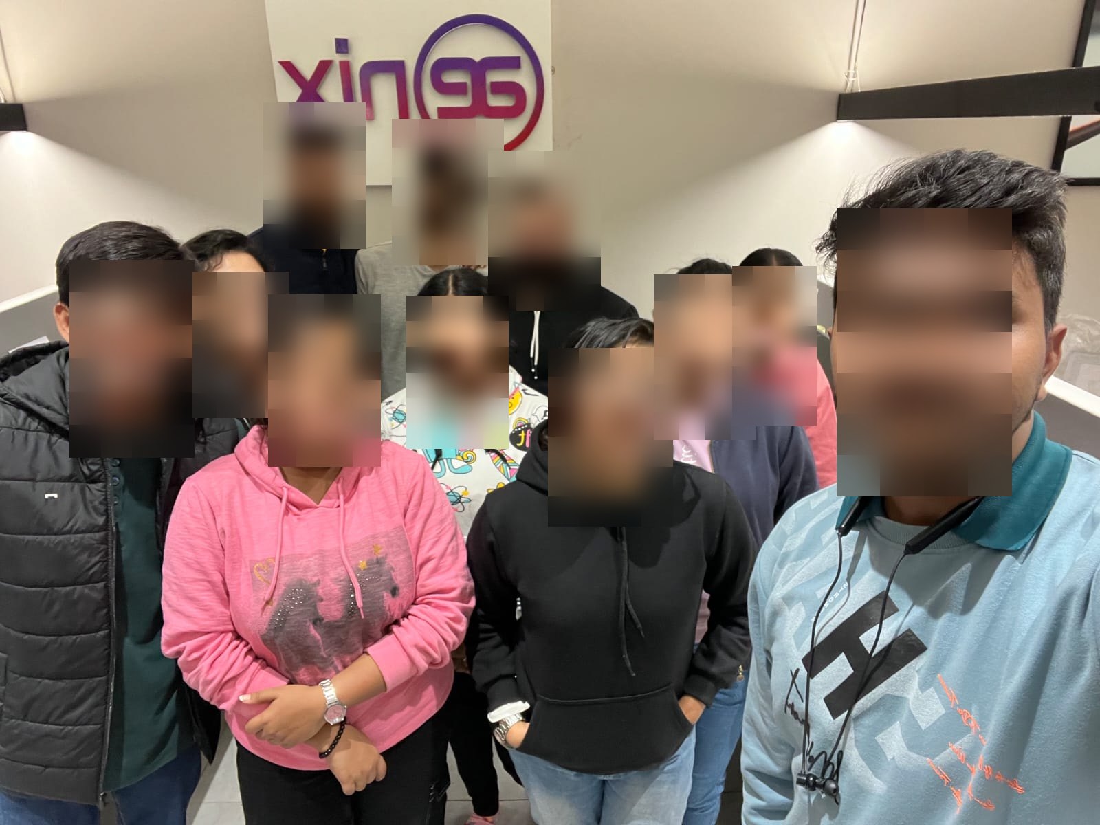 A second group photograph of the MERN stack industrial training cohort. All eleven faces have been masked in the published copy.